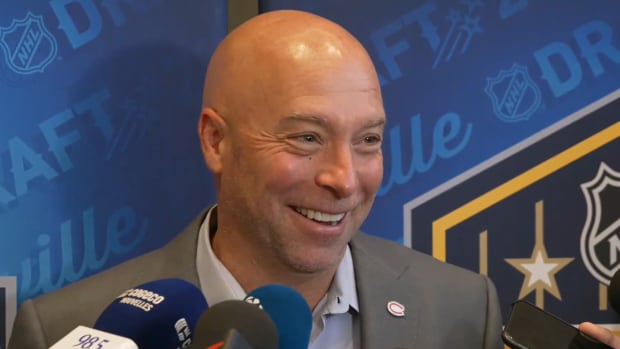 Montreal Canadiens general manager Kent Hughes smiles as he takes questions from the media.