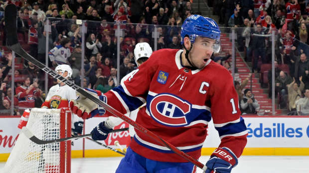 Apr 2, 2024; Montreal, Quebec, CAN; Montreal Canadiens forward Nick Suzuki (14) celebrates after scoring a goal against the Florida Panthers during the second period at the Bell Centre. Mandatory Credit: Eric Bolte-USA TODAY Sports