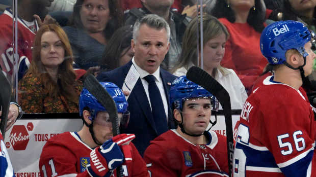Feb 21, 2024; Montreal, Quebec, CAN; Montreal Canadiens head coach Martin St-Louis behind the bench during the first period of the game against the Buffalo Sabres at the Bell Centre. Mandatory Credit: Eric Bolte-USA TODAY Sports