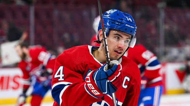 Mar 28, 2024; Montreal, Quebec, CAN; Montreal Canadiens center Nick Suzuki (14) looks on during warm-up before the game against the Philadelphia Flyers at Bell Centre. Mandatory Credit: David Kirouac-USA TODAY Sports