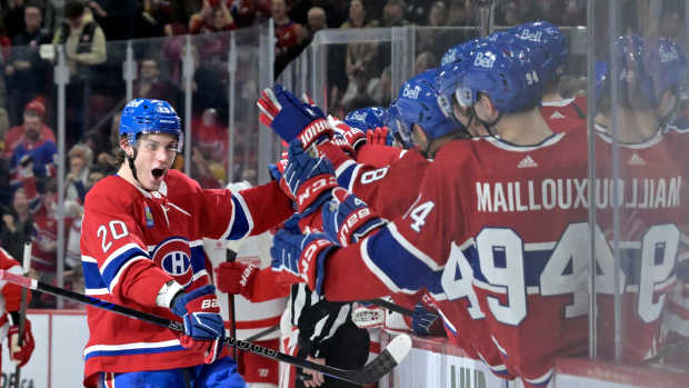 Apr 16, 2024; Montreal, Quebec, CAN; Montreal Canadiens forward Juraj Slafkovsky (20) celebrates with teammates after scoring a goal against the Detroit Red Wings during the third period at the Bell Centre. Mandatory Credit: Eric Bolte-USA TODAY Sports