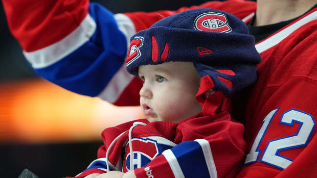 Jan 11, 2022; Las Vegas, Nevada, USA; A young Montreal Canadiens fan watches team warmups before the start of a game against the Vegas Golden Knights at T-Mobile Arena. Mandatory Credit: Stephen R. Sylvanie-USA TODAY Sports