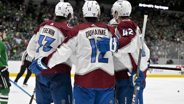 May 9, 2024; Dallas, Texas, USA; Colorado Avalanche center Yakov Trenin (73) and right wing Brandon Duhaime (12) and defenseman Josh Manson (42) celebrates a goal scored by Duhaime against the Dallas Stars during the third period in game two of the second round of the 2024 Stanley Cup Playoffs at American Airlines Center.
