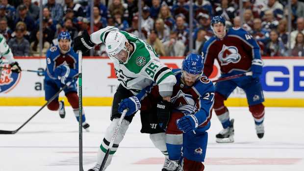 May 13, 2024; Denver, Colorado, USA; Dallas Stars center Matt Duchene (95) and Colorado Avalanche left wing Jonathan Drouin (27) battle for the puck in the third period in game four of the second round of the 2024 Stanley Cup Playoffs at Ball Arena.