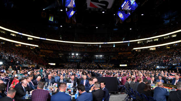 Jun 28, 2023; Nashville, Tennessee, USA; The draft floor and representatives from teams before the 2023 NHL Draft at Bridgestone Arena. Mandatory Credit: Christopher Hanewinckel-USA TODAY Sports
