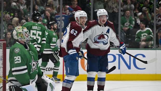 May 15, 2024; Dallas, Texas, USA; Colorado Avalanche left wing Artturi Lehkonen (62) and defenseman Cale Makar (8) celebrates a goal scored by Makar against Dallas Stars goaltender Jake Oettinger (29) during the third period in game five of the second round of the 2024 Stanley Cup Playoffs at American Airlines Center.