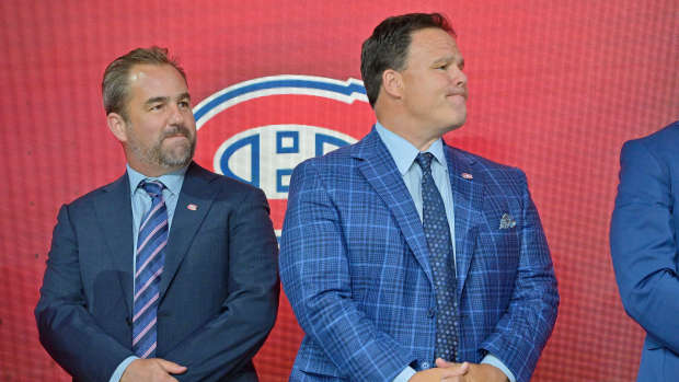 Jul 7, 2022; Montreal, Quebec, CANADA; Montreal Canadiens owner Geoff Molson (left) and executive vice president of hockey operations Jeff Gorton (right) look on before Filip Mesar (not pictured) is selected as the number twenty-six overall pick to the Montreal Canadiens in the first round of the 2022 NHL Draft at Bell Centre. Mandatory Credit: Eric Bolte-USA TODAY Sports