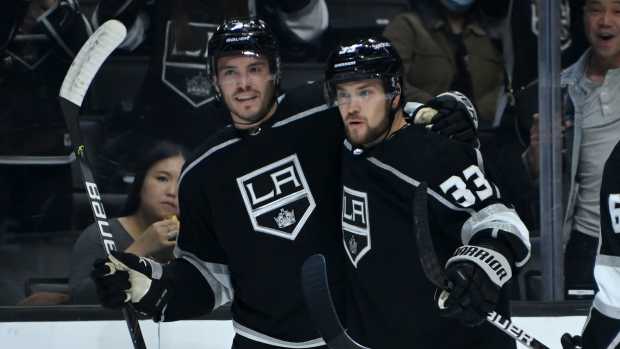Oct 30, 2021; Los Angeles, California, USA; Los Angeles Kings right wing Viktor Arvidsson (33) is congratulated by defenseman Matt Roy (3) after scoring a goal in the second period of the game against the Montreal Canadiens at Staples Center. Mandatory Credit: Jayne Kamin-Oncea-USA TODAY