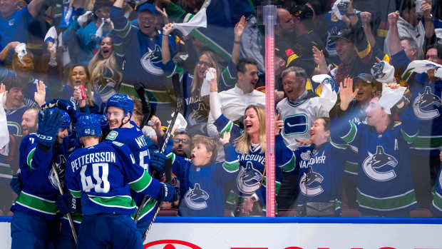May 16, 2024; Vancouver, British Columbia, CAN; Vancouver Canucks forward Elias Pettersson (40) and defenseman Tyler Myers (57) and defenseman Carson Soucy (7) and forward J.T. Miller (9) celebrate Miller’s game winning goal against the Edmonton Oilers during the third period in game five of the second round of the 2024 Stanley Cup Playoffs at Rogers Arena. Mandatory Credit: Bob Frid-USA TODAY Sports