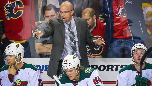 Jan 29, 2015; Calgary, Alberta, CAN; Minnesota Wild head coach Mike Yeo on his bench against the Calgary Flames during the third period at Scotiabank Saddledome. Minnesota Wild won 1-0. Mandatory Credit: Sergei Belski-USA TODAY Sports