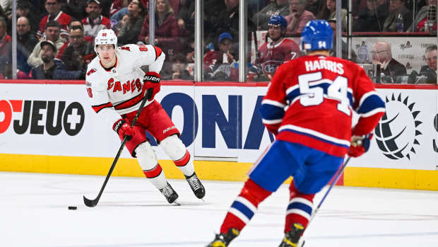 Apr 1, 2023; Montreal, Quebec, CAN; Carolina Hurricanes center Martin Necas (88) plays the puck against the Montreal Canadiens during the second period at Bell Centre. Mandatory Credit: David Kirouac-USA TODAY Sports