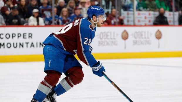 May 13, 2024; Denver, Colorado, USA; Colorado Avalanche center Nathan MacKinnon (29) controls the puck in the third period against the Dallas Stars in game four of the second round of the 2024 Stanley Cup Playoffs at Ball Arena.