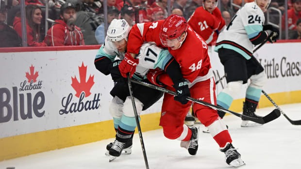 Red Wings edged by Devils in season-opener 4-3 