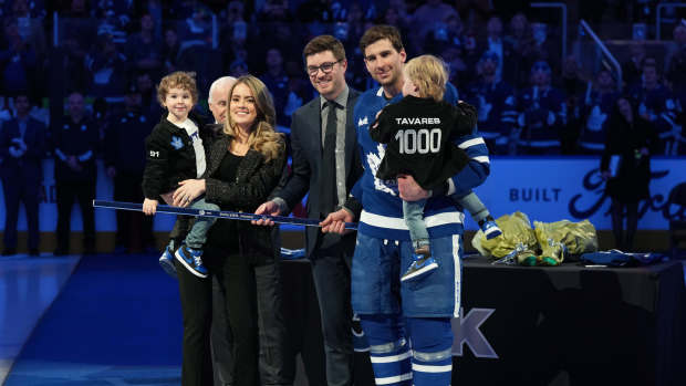 Jan 29, 2023; Toronto, Ontario, CAN; Toronto Maple Leafs center John Tavares (91) receives a commemorative hockey stick from Toronto Maple Leafs General Manager Kyle Dubas for his1000th NHL game ceremony against the Washington Capitals at Scotiabank Arena. Mandatory Credit: Nick Turchiaro-Imagn Images