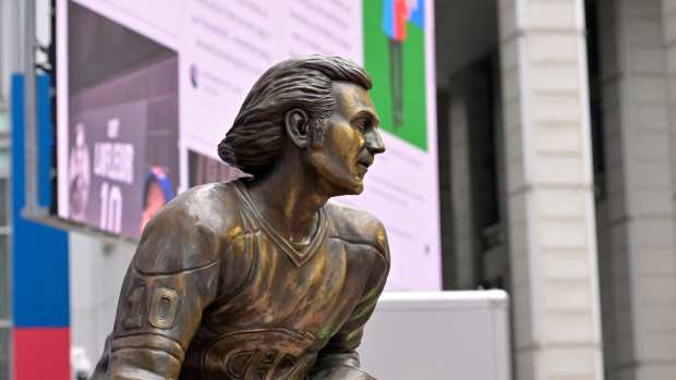 Apr 24, 2022; Montreal, Quebec, CAN; A detail view of the bronze statue of Guy Lafleur before the game between the Boston Bruins and the Montreal Canadiens at the Bell Centre. Mandatory Credit: Eric Bolte-Imagn Images