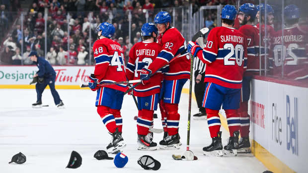 Dec 17, 2024; Montreal, Quebec, CAN; Montreal Canadiens right wing Patrik Laine (92) celebrates his hat trick with his teammates as the ice gets covered with hats against the Buffalo Sabres during the second period at Bell Centre. Mandatory Credit: David Kirouac-Imagn Images