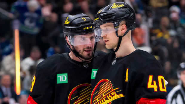 Dec 23, 2024; Vancouver, British Columbia, CAN; Vancouver Canucks forward J.T. Miller (9) and forward Elias Pettersson (40) talk during a stop in play against the San Jose Sharks in the first period at Rogers Arena. Mandatory Credit: Bob Frid-Imagn Images