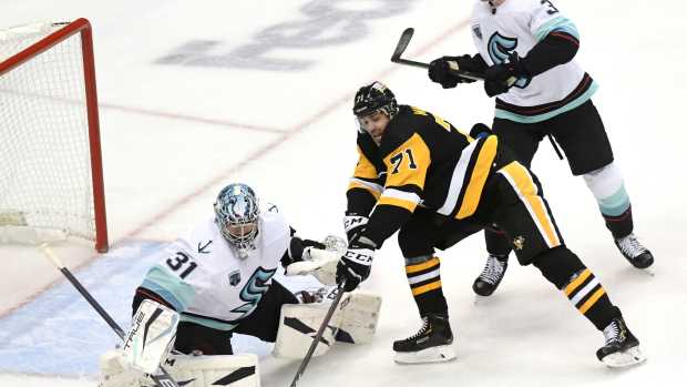 Jan 27, 2022; Pittsburgh, Pennsylvania, USA; Pittsburgh Penguins center Evgeni Malkin (71) is stopped by Seattle Kraken goalie Philipp Grubauer (31) during the second period at PPG Paints Arena. Mandatory Credit: Philip G. Pavely-Imagn Images