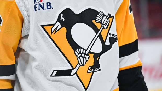 Dec 12, 2024; Montreal, Quebec, CAN; View of a Pittsburgh Penguins logo on a jersey worn by a member of the team during the second period at Bell Centre. Mandatory Credit: David Kirouac-Imagn Images  