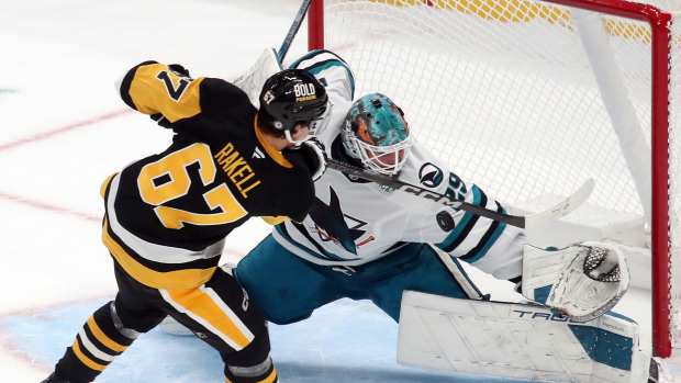 Nov 16, 2024; Pittsburgh, Pennsylvania, USA; San Jose Sharks goaltender Mackenzie Blackwood (29) makes a save against Pittsburgh Penguins right wing Rickard Rakell (67) in the shootout at PPG Paints Arena. Mandatory Credit: Charles LeClaire-Imagn Images  