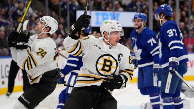 Mar 4, 2024; Toronto, Ontario, CAN; Boston Bruins forward Brad Marchand (63) reacts after a goal by forward Jake DeBrusk (74) against the Toronto Maple Leafs during the second period at Scotiabank Arena. Mandatory Credit: John E. Sokolowski-USA TODAY Sports