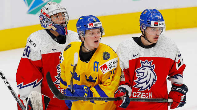Aug 20, 2022; Edmonton, Alberta, CAN; Team Sweden forward Are Stakkestad (15) and Team Czechia defensemen David Spacek (3) battle in front of Team Czechia goaltender Tomas Suchanek (30) during the second period in the third place game during the IIHF U20 Ice Hockey World Championship at Rogers Place. Mandatory Credit: Perry Nelson-USA TODAY Sports