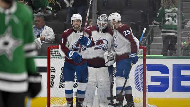 May 15, 2024; Dallas, Texas, USA; Colorado Avalanche goaltender Alexandar Georgiev (40) and defenseman Devon Toews (7) and center Nathan MacKinnon (29) celebrate defeating the Dallas Stars in game five of the second round of the 2024 Stanley Cup Playoffs at American Airlines Center.