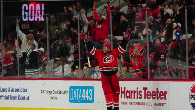 Jan 13, 2024; Raleigh, North Carolina, USA; Carolina Hurricanes defenseman Brett Pesce (22) celebrates his game winning goal in the overtime against the Pittsburgh Penguins at PNC Arena. 