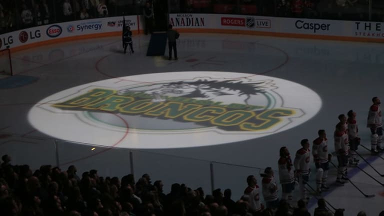 Hockey parents and fans line up to have Humboldt Broncos logo