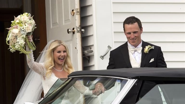 Toronto Maple Leafs captain Dion Phaneuf, right, waves as he arrives at his  wedding to actress Elisha Cuthbert at St. James Catholic Church in  Summerfield, P.E.I. on Saturday, July 6, 2013. THE