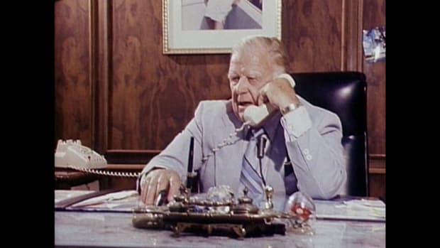 Harold Ballard in his officeat Maple Leaf Gardenstalking on phone