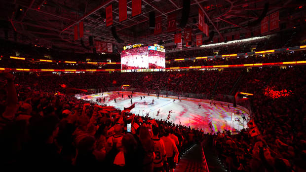 Apr 20, 2024; Raleigh, North Carolina, USA; The fans get ready for the start of the game between the Carolina Hurricanes and New York Islanders in game one of the first round of the 2024 Stanley Cup Playoffs at PNC Arena.