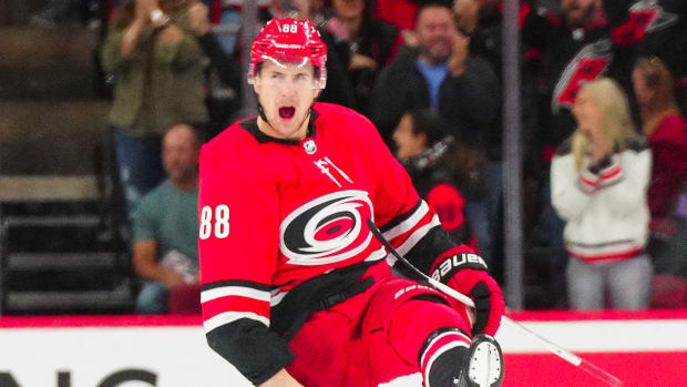 Oct 26, 2023; Raleigh, North Carolina, USA; Carolina Hurricanes center Martin Necas (88) celebrates his game winning goal in the overtime against the Seattle Kraken at PNC Arena. 
