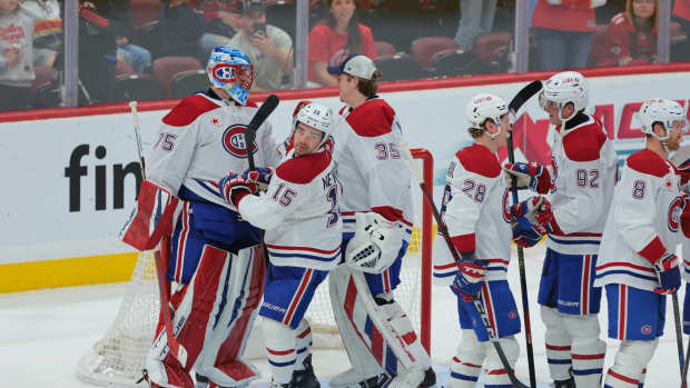 Dec 28, 2024; Sunrise, Florida, USA; Montreal Canadiens goaltender Jakub Dobes (75) celebrates with teammates after winning the game against the Florida Panthers at Amerant Bank Arena. Mandatory Credit: Sam Navarro-Imagn Images