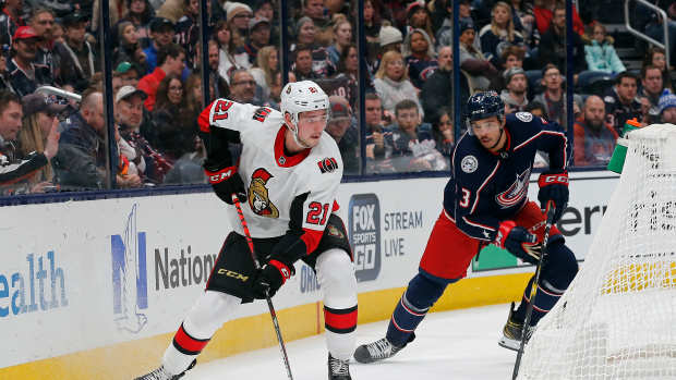 Nov 25, 2019; Columbus, OH, USA; Ottawa Senators center Logan Brown (21) skates with the puck as Columbus Blue Jackets defenseman Seth Jones (3) trails the play during the first period at Nationwide Arena. Mandatory Credit: Russell LaBounty-USA TODAY Sports