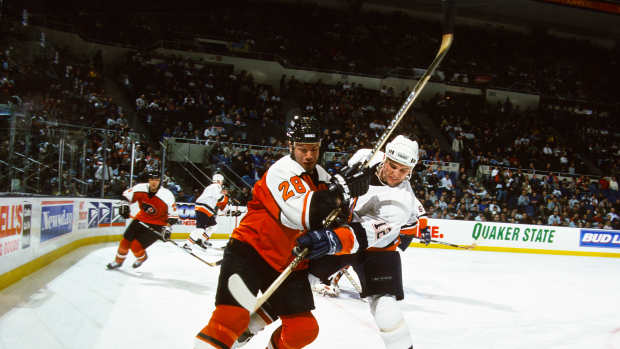 Mar 9, 1999; Uniondale, NY, USA; FILE PHOTO; New York Islanders left wing Mike Watt (12) in action against Philadelphia Flyers center Marc Bureau (28) at Nassau Coliseum. Mandatory Credit: Lou Capozzola-USA TODAY NETWORK