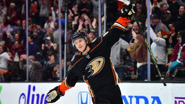 Jan 28, 2023; Anaheim, California, USA; Anaheim Ducks center Trevor Zegras (11) celebrates his goal scored against the Arizona Coyotes during the overtime period for the victory at Honda Center. Mandatory Credit: Gary A. Vasquez-USA TODAY Sports