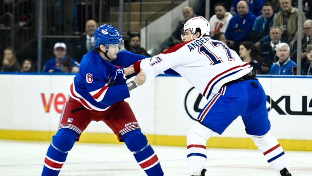 Nov 30, 2024; New York, New York, USA; New York Rangers defenseman Jacob Trouba (8) and Montreal Canadiens right wing Josh Anderson (17) fight during the first period at Madison Square Garden. Mandatory Credit: John Jones-Imagn Images