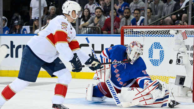May 30, 2024; New York, New York, USA; Florida Panthers defenseman Gustav Forsling (42) scores a goal against New York Rangers goaltender Igor Shesterkin (31) during the second period in game five of the Eastern Conference Final of the 2024 Stanley Cup Playoffs at Madison Square Garden. Mandatory Credit: Dennis Schneidler-USA TODAY Sports  