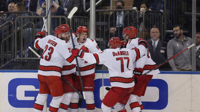 May 13, 2024; New York, New York, USA; Carolina Hurricanes center Evgeny Kuznetsov (92) celebrates his goal against the New York Rangers with teammates during the third period of game five of the second round of the 2024 Stanley Cup Playoffs at Madison Square Garden. 