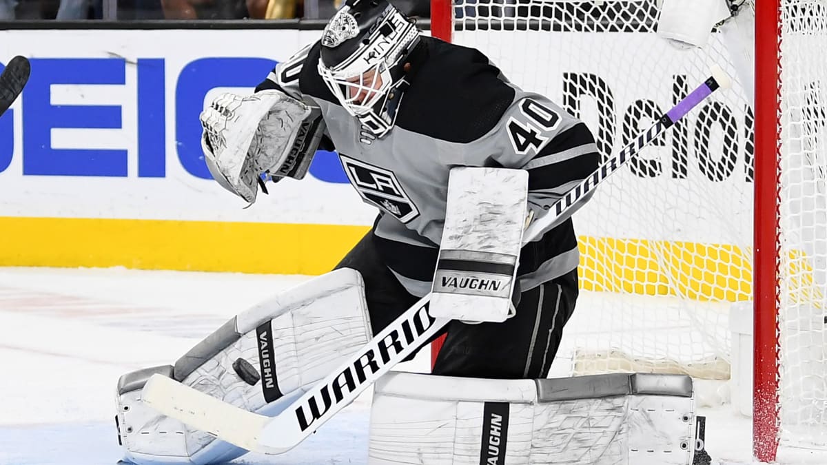 FILE - Los Angeles Kings goaltender Calvin Petersen (40) wears a  Pride-themed jersey and holds a stick wrapped in rainbow tape for Pride  night while warming up before an NHL hockey game