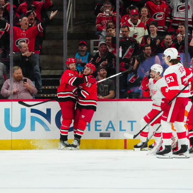 Carolina Hurricanes center Sebastian Aho (20) is congratulated by left wing Jake Guentzel (59) after a goal