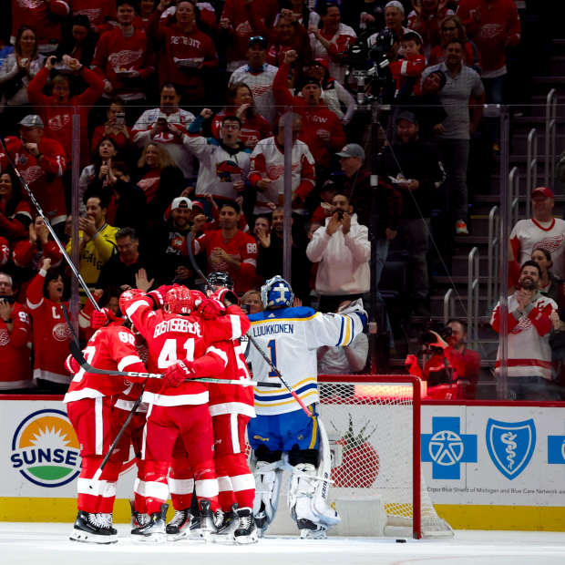 Apr 7, 2024; Detroit, Michigan, USA; Detroit Red Wings center Dylan Larkin (71) receives congratulations from teammates after scoring in the first period against the Buffalo Sabres at Little Caesars Arena
