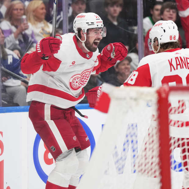 Detroit Red Wings center Dylan Larkin (71) scores the winning goal and celebrates with right wing Patrick Kane (88) against the Toronto Maple Leafs