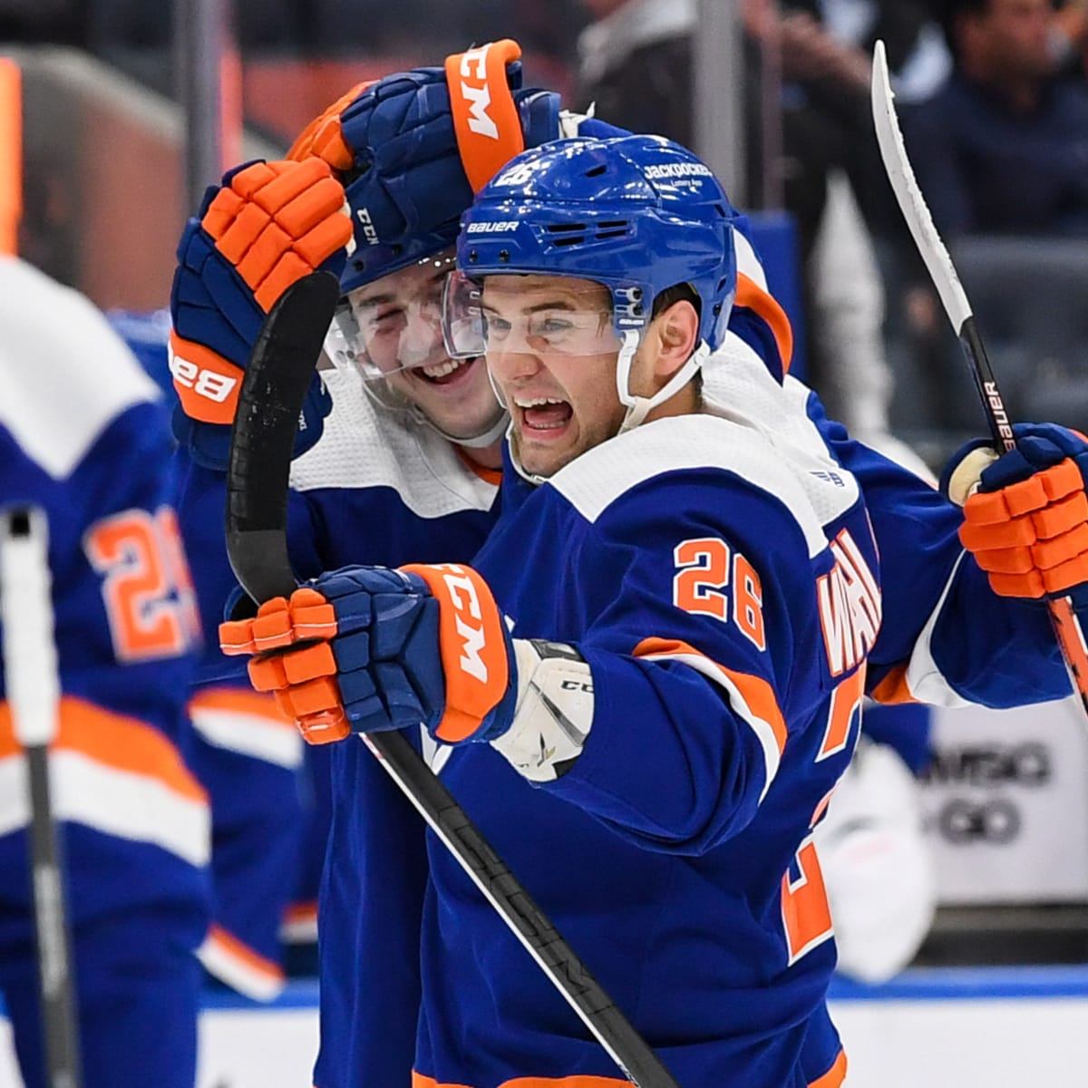 New York Islanders Mike Bossy sits on the ice at the end of the