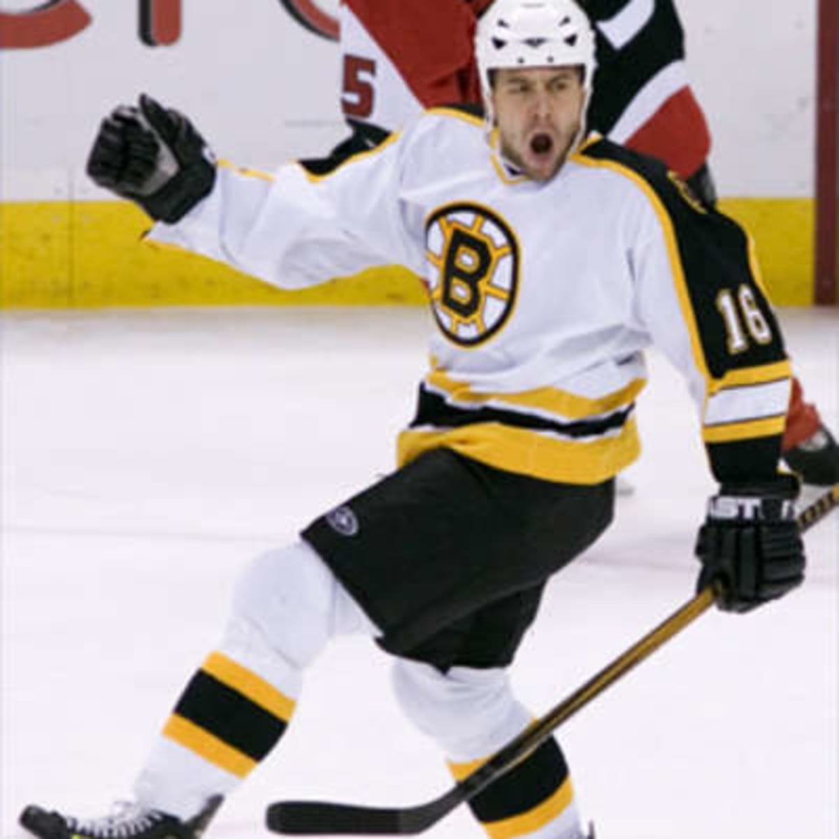 Boston Bruins left wing Marco Sturm (16) chases down a loose puck