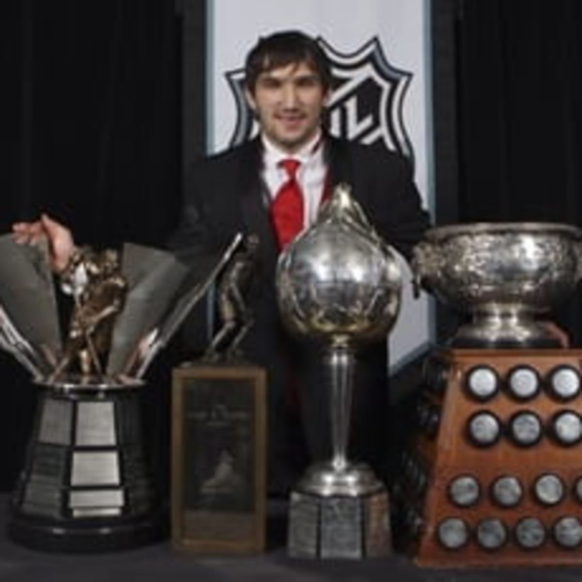 Alex Ovechkin receives mini trophies for winning Stanley Cup and being  named playoff MVP