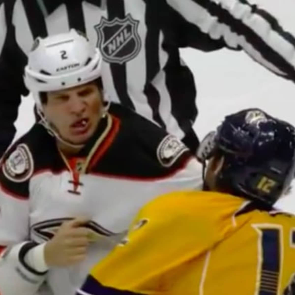 watch-kevin-bieksas-tooth-go-flying-during-fight-with-mike-fisher.jpg