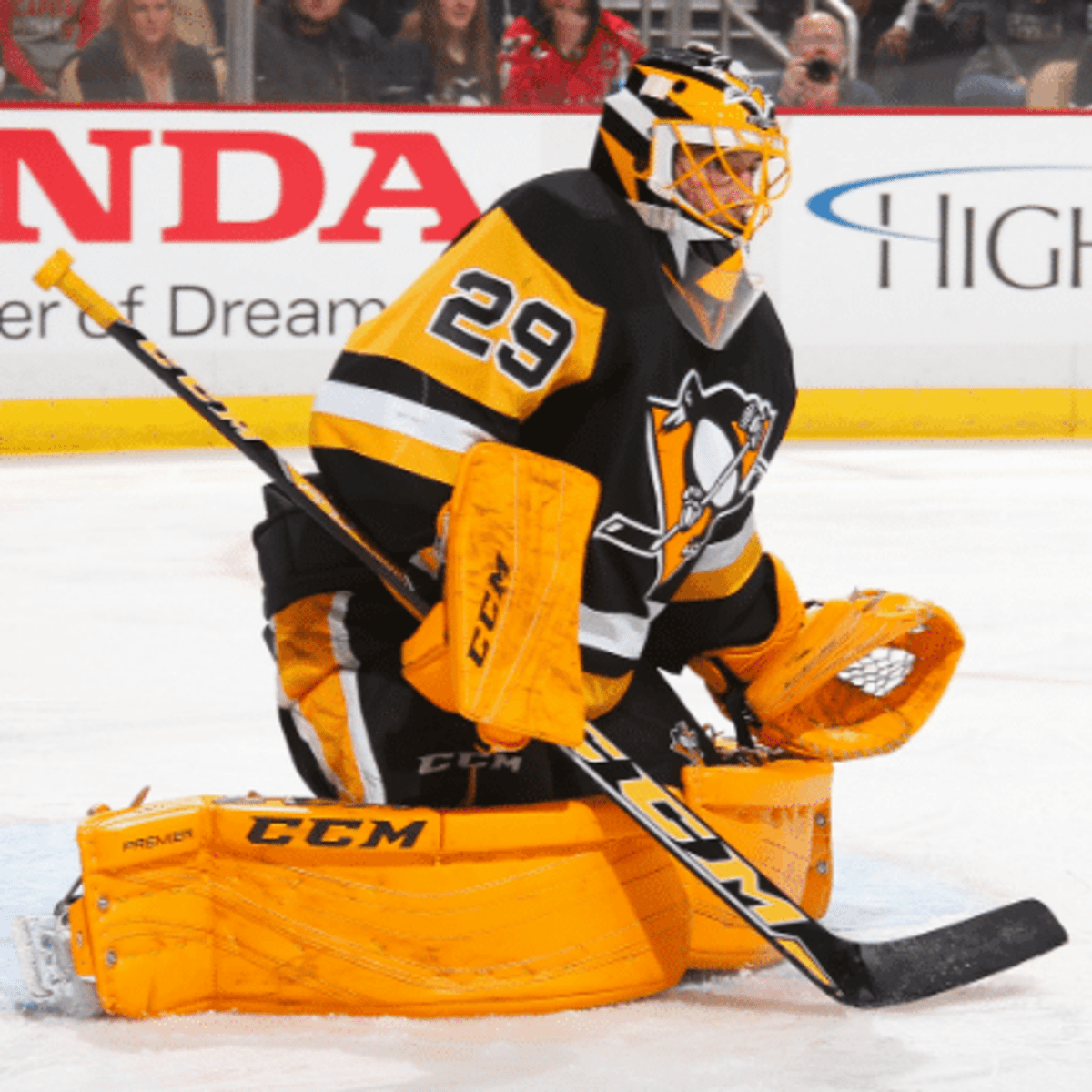 Pittsburgh Penguins goalie Marc-Andre Fleury watches the puck bounce off  his pads as he makes a save against the Detroit Red Wings in the first  period of game three of the 2008