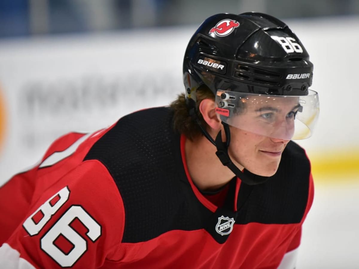 Nico Hischier and Jack Hughes of the New Jersey Devils prepare for